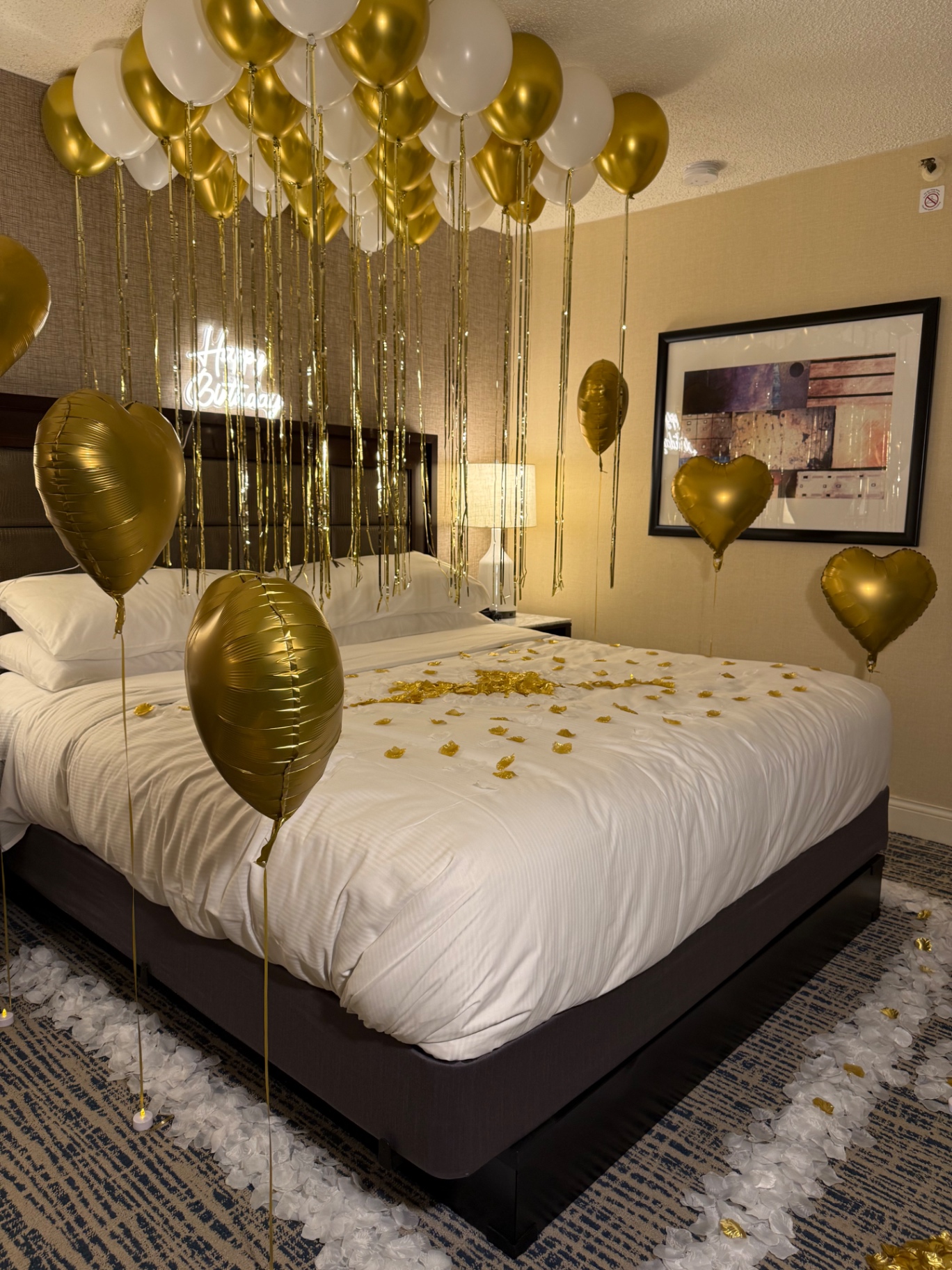 Gold and white luxury birthday hotel suite